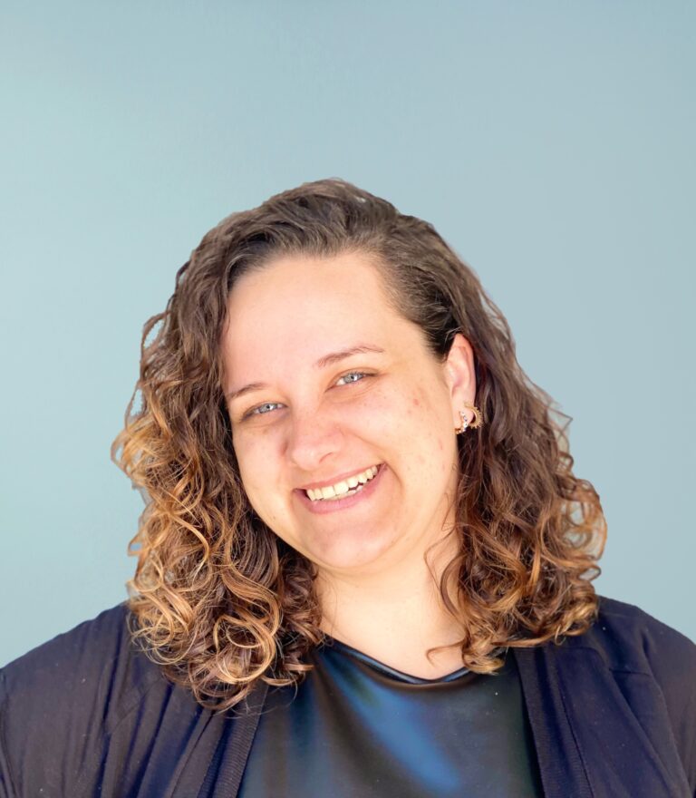 Portrait of Caroline andrew on a light blue background