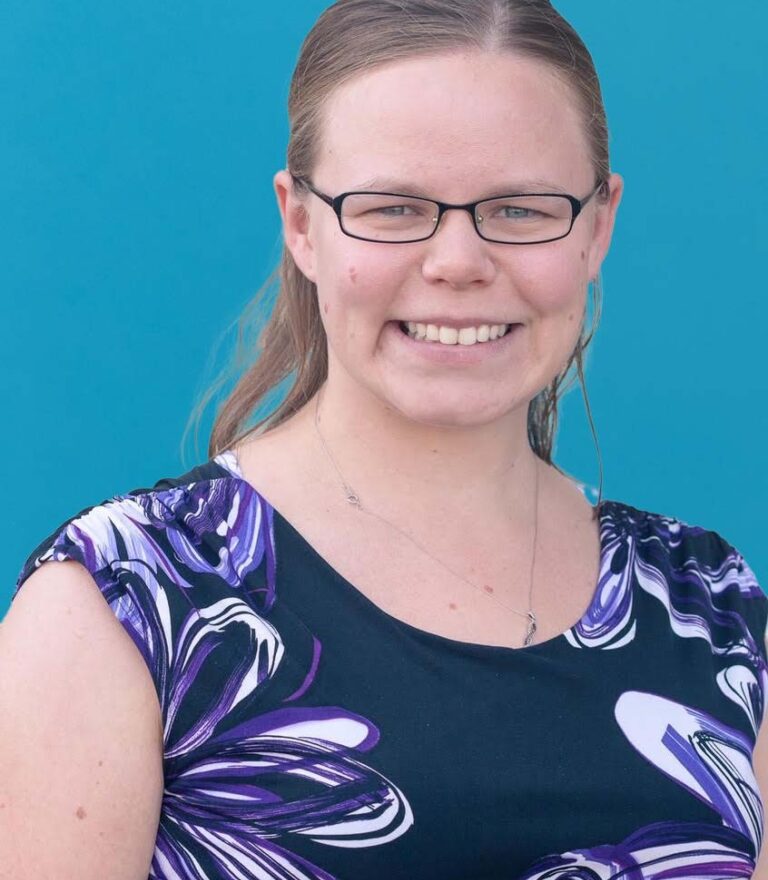 portrait of kascey on a blue background