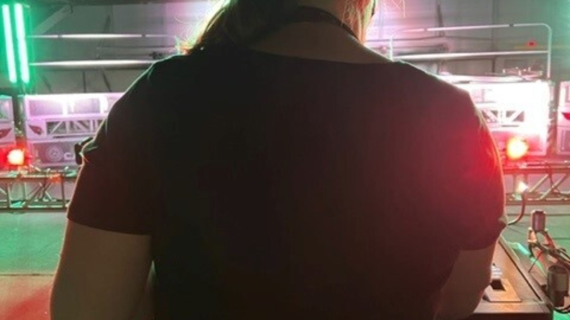 Kascey's back at she works at a console